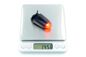 CarbonWorks-red-bicycle-flashlight-taillight-light-on-scale-web
